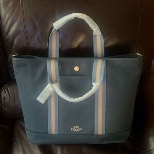 COACH New, never used Blue Canvas Ellis Weekender tote. Excellent condition!